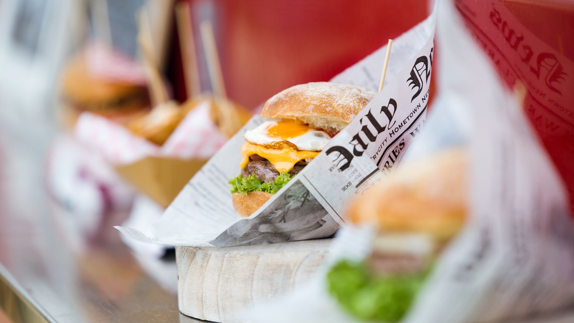 A burger in food wrapping paper